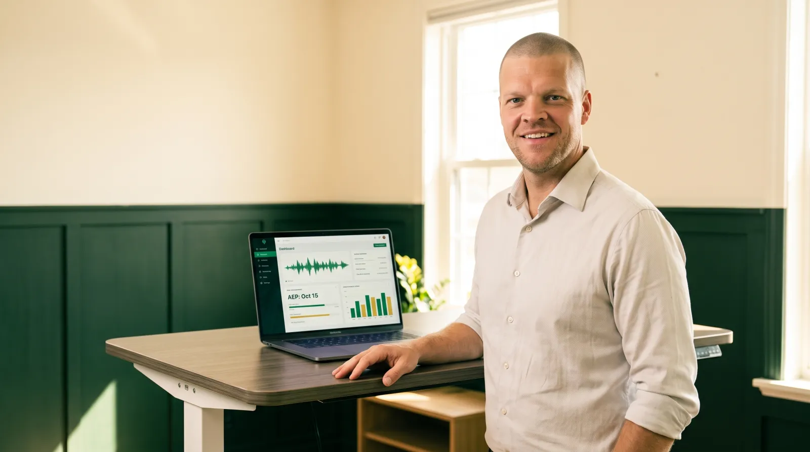 Mike Moore, founder of TheAffordableAI, standing beside a warm-lit desk where a laptop displays a call-volume dashboard counting down to the Medicare Annual Enrollment Period with an emerald voice waveform